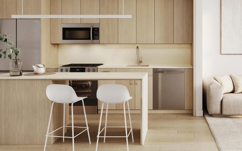 a kitchen with a white table and chairs