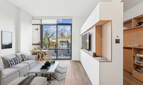 living room with desk chair and windows