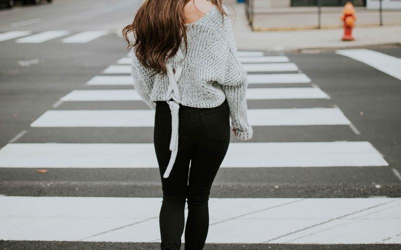 a person walking in a crosswalk